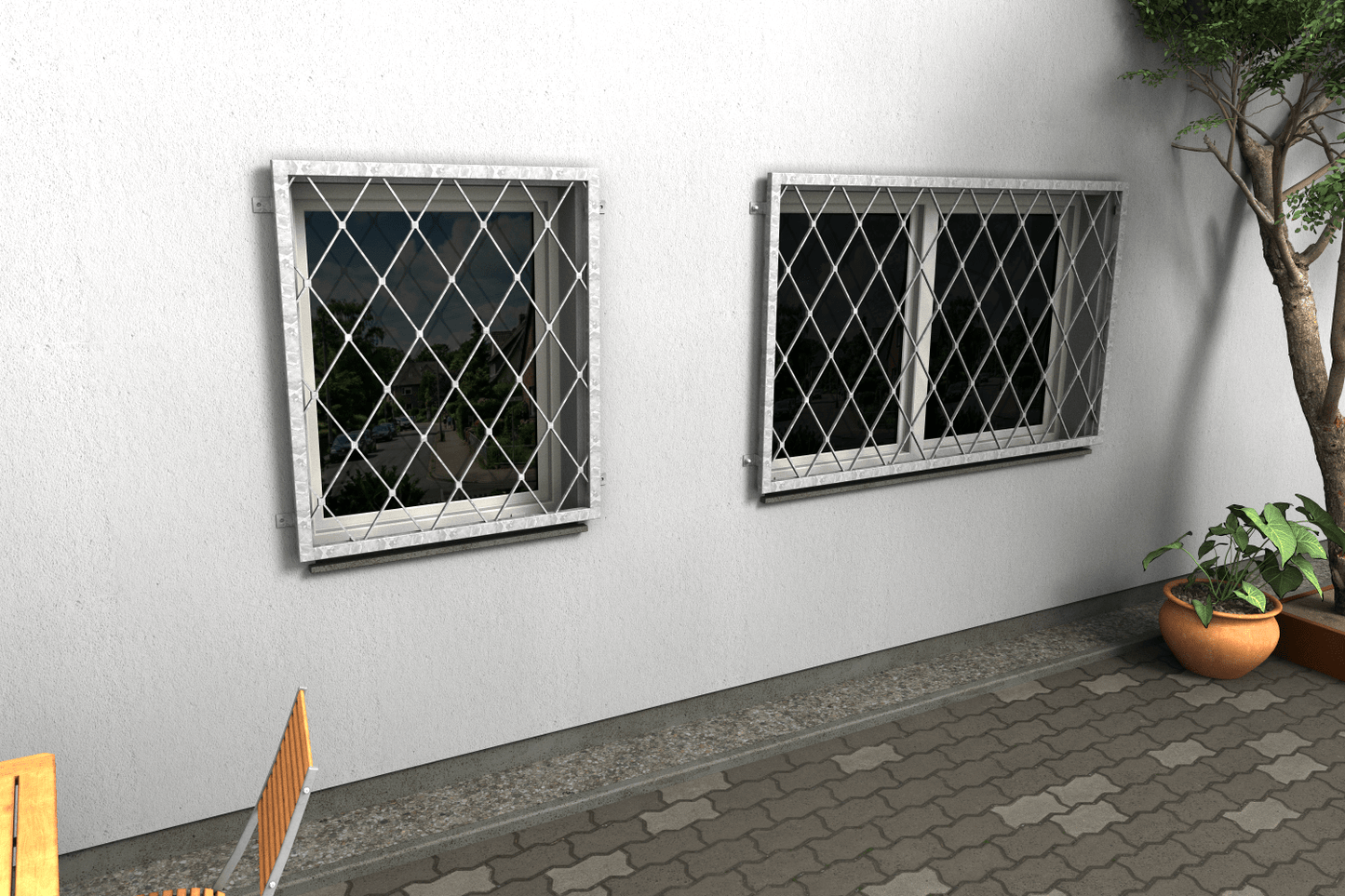 Zwei Fenstergitter aus feuerverzinktem Stahl mit Rautenmuster als Einbruchschutz an einer Hausfassade